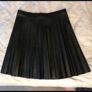 Pleated faux leather mini skirt